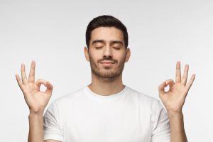 man meditating and relaxing