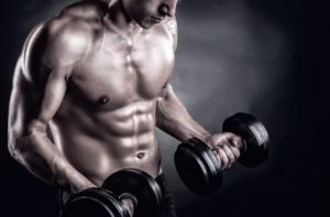 fit man lifting free weights