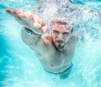 athletic man swimming