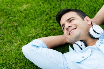 man relaxing by the lawn